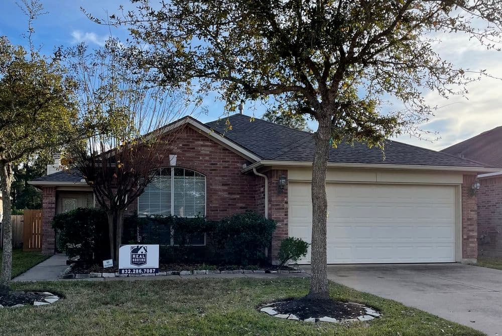 Brick home for sale with landscaped yard and garage in residential neighborhood.